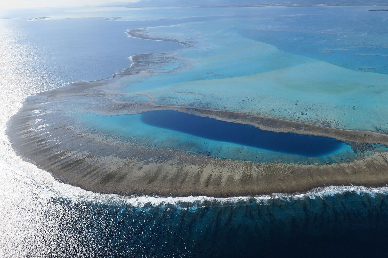 Blue hole in New Caledonia's coral reef